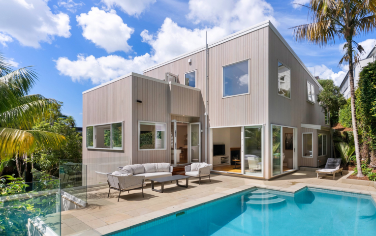 Rear exterior and pool area of St Georges Bay Rd renovation with Alaskan Yellow Cedar timber cladding