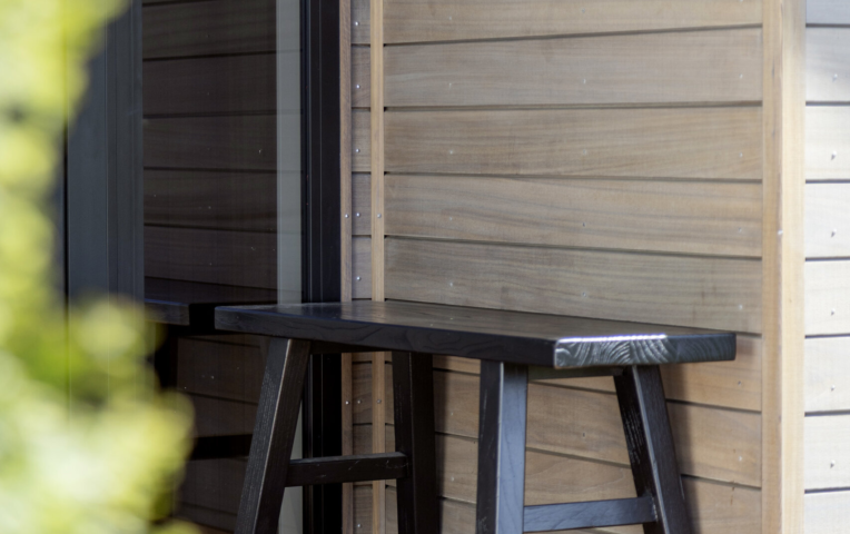 Exterior detail of home with horizontal cladding in TMT Amba