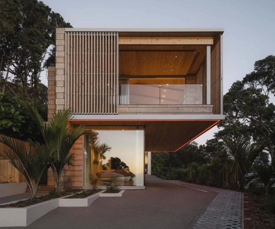 Exterior view of Muriwai home with rustic cedar cladding and battens & screens