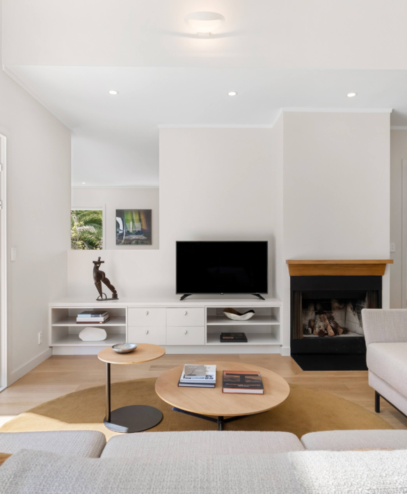 Interior living area of St Georges Bay Rd renovation with natural light and open-plan layout