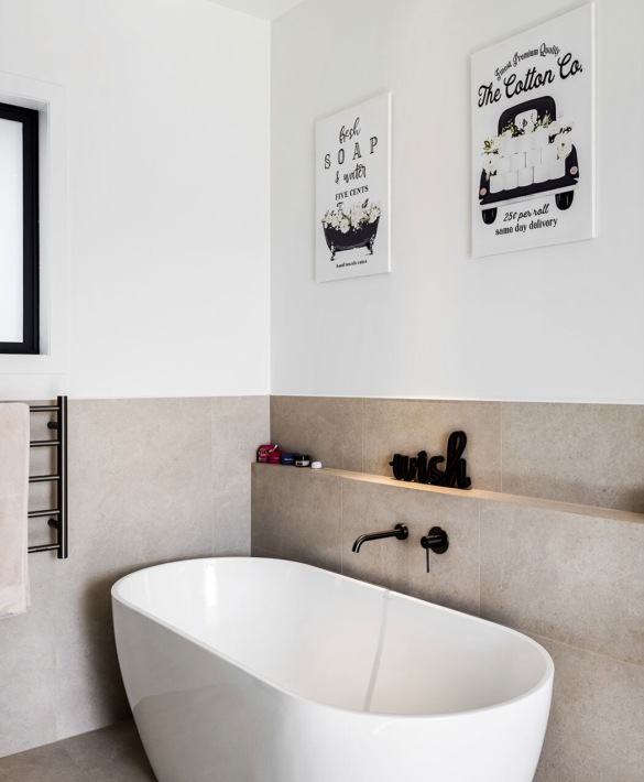 The bath and bathroom details in Point Wells barn-style home