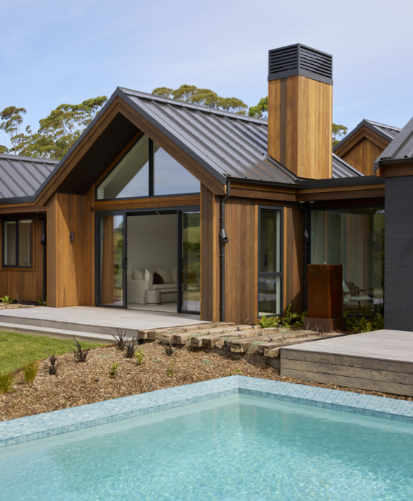 Exterior of Palliser Downs Showhome and pool with JSC's TMT Taxon vertical shiplap cladding