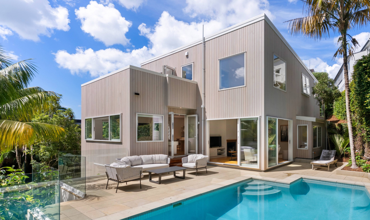 Rear exterior and pool area of St Georges Bay Rd renovation with Alaskan Yellow Cedar timber cladding