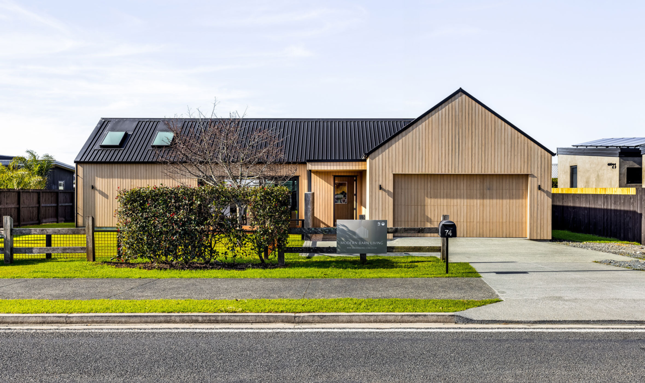 Contemporary barn-style home in Point Wells with vertical shiplap cladding