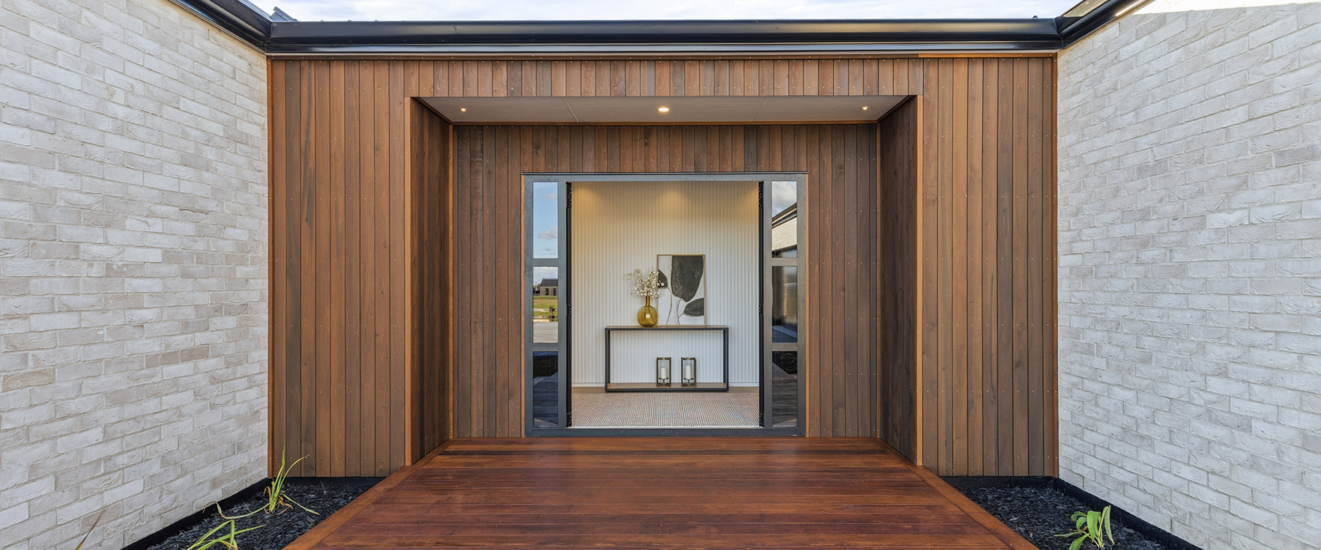 Entry exterior of Ngahinapouri home with TMT Taxon cladding